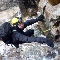 Andy-learning-about-placing-protection-in-icy-winter-cracks