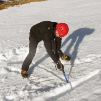 003-glen-nevis-stob-coire-nan-lochan.-iain-digging-a-buried-axe-snow-anchor