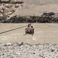 The trip begins with a river crossing - all of our kit and our team members are hauled across