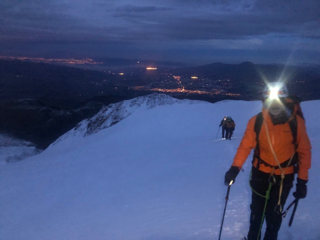 Ascent of Cayambe with Quito in The Background